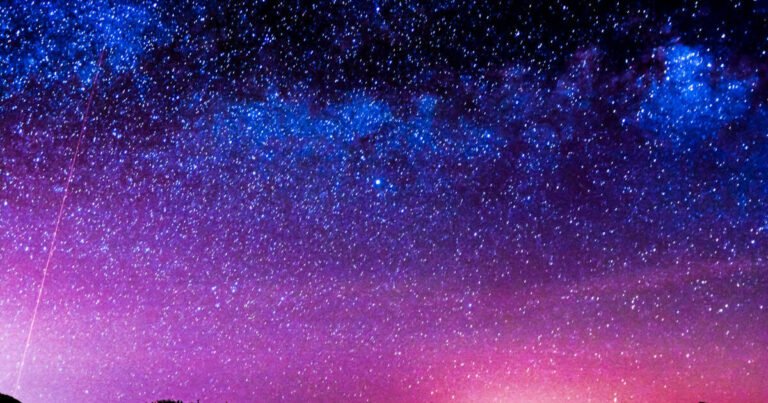 Enchanting night sky: deep blue and purple adorned with countless stars.