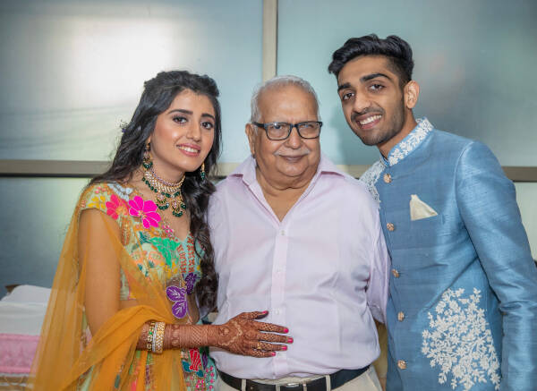 Grandfather with his granddaughter and grandson on wedding day.