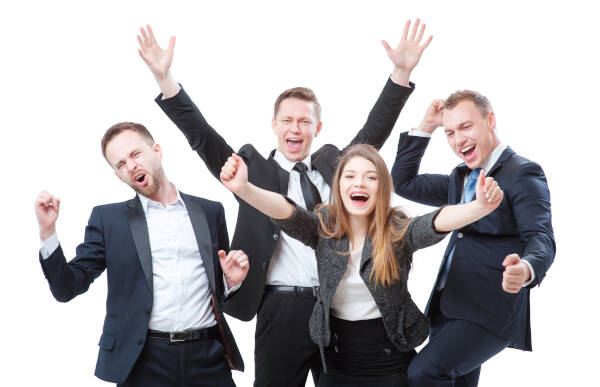 Group of four happy businesspeople in formal wear cheering and celebrating
