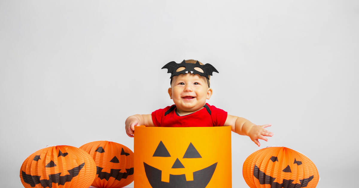 A Halloween-themed portrait of a joyful child.