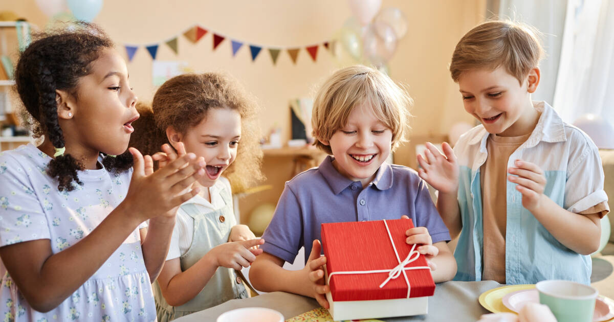 Diverse Group Of Happy Children At a Party With Excited expressions of joy.
