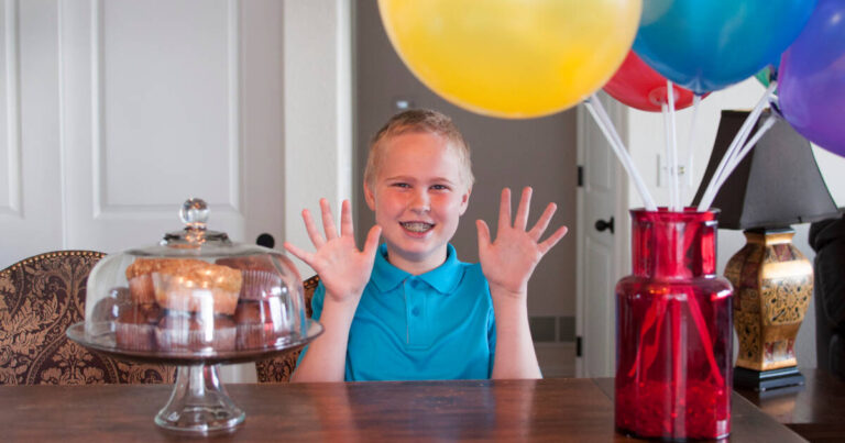 Ten Year Old Celebrates With Cupcakes And Balloons