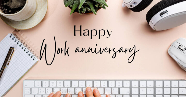 Top view of a workspace with a keyboard, mouse, headphones, notebook, pen, coffee cup, and plant on a desk, featuring the text “Happy Work Anniversary.”