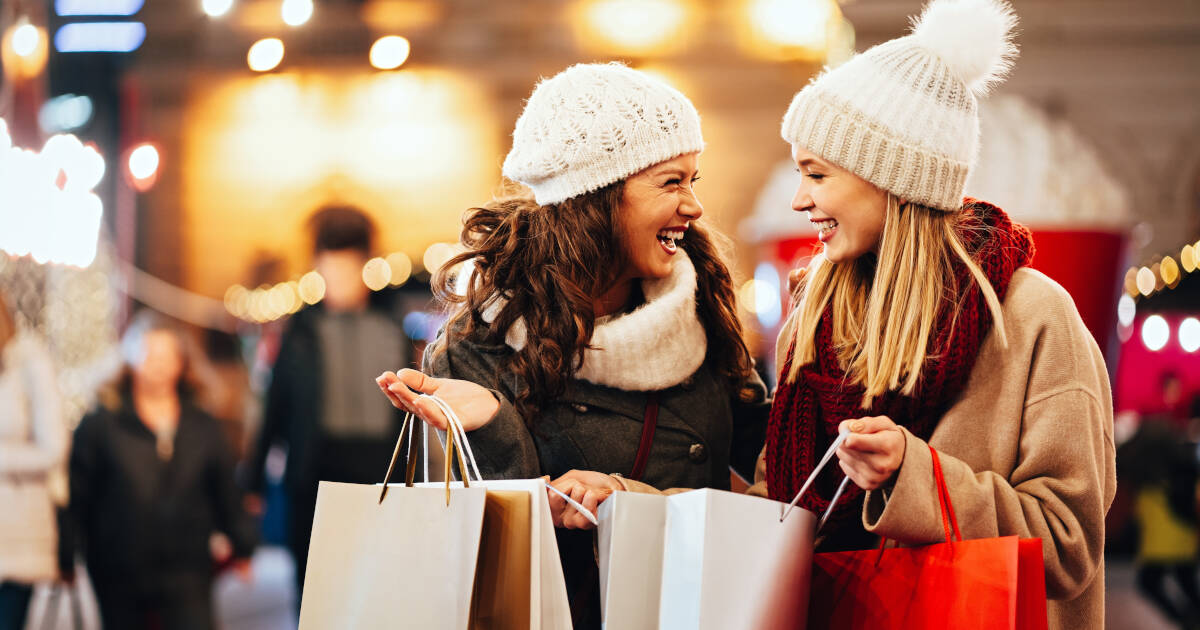 Happy Women Shopping for Christmas Presents